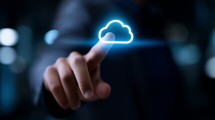 A man's finger is about to touch a glowing blue cloud icon, symbolizing cloud computing, data storage, and digital technology.
