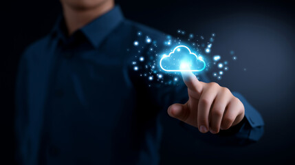 A man's finger is about to touch a glowing blue cloud icon, symbolizing cloud computing, data storage, and digital technology.
