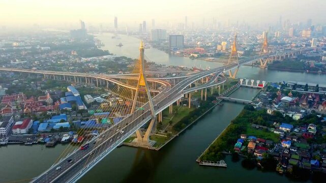 The bhumibol bridge spans the chao phraya river in bangkok