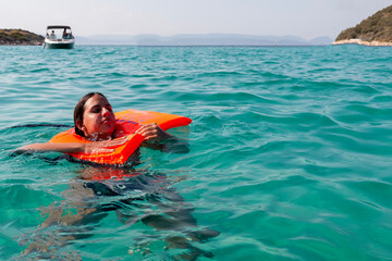 Drowning person holding water rescue emergency equipment. Safety water equipment.