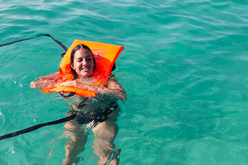 Drowning woman was saved in sea, closeup. Safety water equipment.