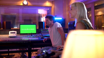 Music producers collaborating in a professional recording studio