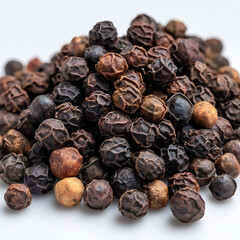 Obraz premium Pile of dark and brown peppercorns with textured surfaces black pepper whole peppercorns