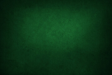 Green concrete wall background. Dark edges