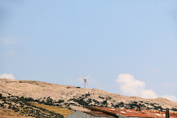 Wind turbine on the hill on island Pag, Croatia.