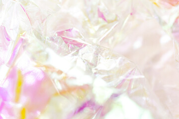 Abstract Crumpled Translucent Plastic with Light Reflections – Colorful Close-Up Texture in Pink, Yellow, and White for Modern Design, Packaging, and Visual Art Concepts
