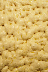 Fermented focaccia dough before baking in the oven