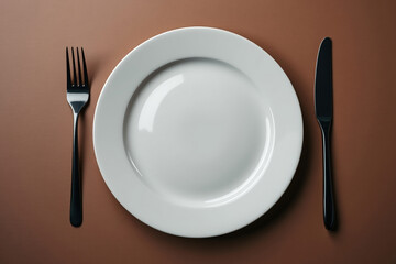 Minimalist Table Setting with White Plate Black Fork and Knife on a Brown Surface A Clean and Modern Dining Arrangement