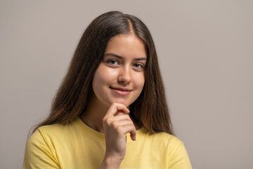 Fototapeta premium Portrait of a confident and intelligent young woman thinking.