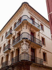 Building facade in Bilbao’s Casco Viejo, showcasing traditional Basque architecture and historic...