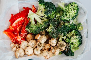 Fresh vegetables seasoned with herbs ready for grilling or roasting at home