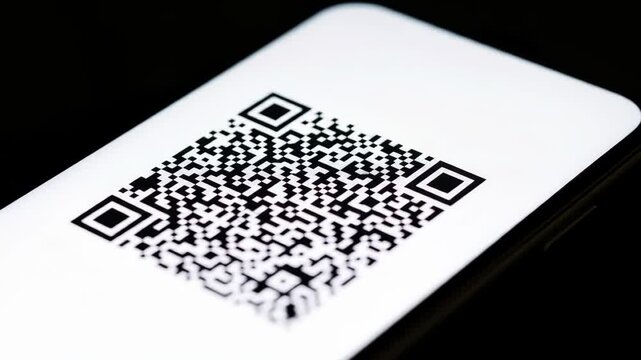 Smartphone displaying a QR code with white background for scanning technology.