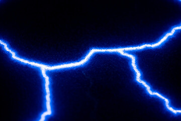 Vibrant electric blue lightning bolts illuminate a dark background, creating a striking contrast....