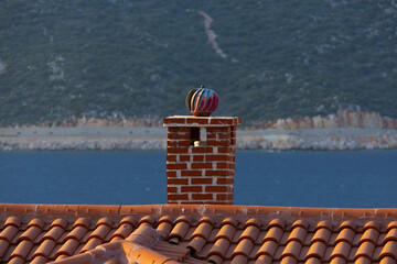 Stone chimney on the roof