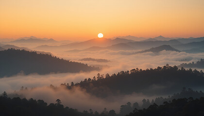 Obraz premium The dawn unveils a serene mountain landscape, with misty valleys and a glowing sunrise painting the sky in shades of orange and gold.