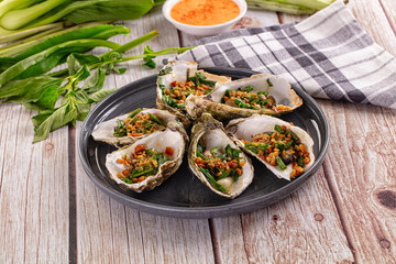 Gournet grilled oysters with onion and peanut