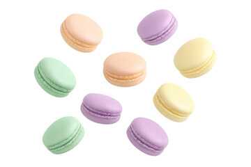 Obraz premium Pastel macarons floating weightlessly, displaying delicate pink, yellow, green, and purple hues on transparent surface