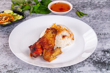 Spicy roasted chicken wing with rice