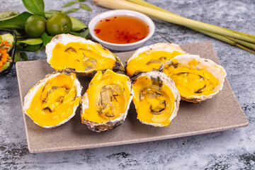 Baked oyster with cheddar cheese