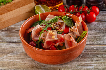 Salad with jamon, strawberry and arugula