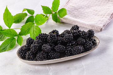 Raw sweet juicy blackberry in the bowl