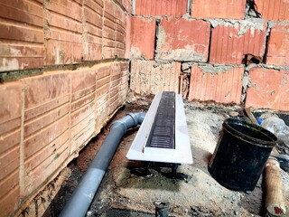 Leveling the bathroom sink with a spirit level