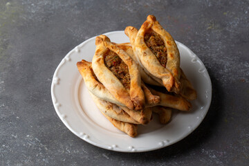 Dishes from traditional Turkish cuisine; Mini pita with minced meat - Turkish name; Kiymali mini...