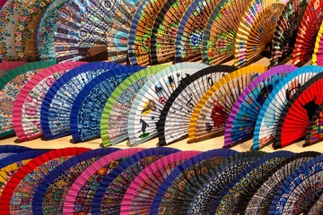 Vibrant Multi Coloured Artisan Cooling Fans Seville Souvenir Shop Sale.  Delicate Decorated Hand Painted Craft Material Close-Up Accessory, Andalucia Spain