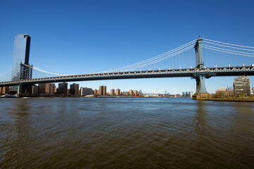 Manhattan Bridge Over East River on Sunny Day