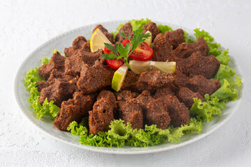 Traditional delicious Turkish food; Turkish name; Cig kofte (raw meatball in Turkish) with lettuce