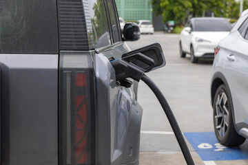 Electric car charging station. Hybrid car Electric charger station in the Car Park. Electric car...