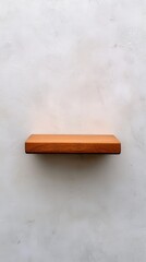 Simple Wooden Shelf Against Textured Light Wall Surface