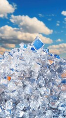 Clear Ice Cubes Piled Against a Bright Blue Sky with Clouds