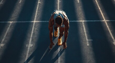 A muscular athlete in a low starting position on a running track, sunlight casting long shadows, poised for a sprint