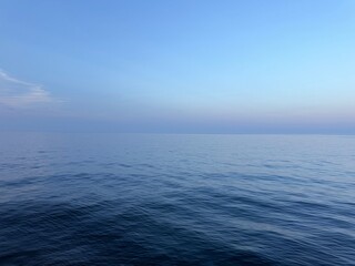 Sea calm blue water and blue sky.