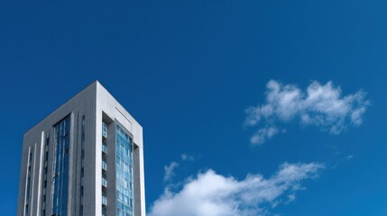 Modern building architecture glass facade clear blue sky white clouds