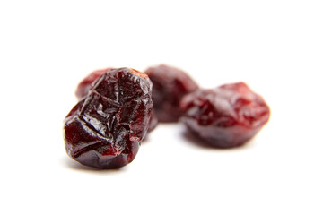 Dried cranberries arranged artistically on a white background, showcasing their rich color, texture, and natural appeal, perfect for culinary and health-related imagery