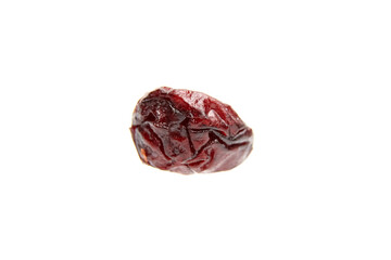 Isolated dried cranberry against a bright white background. Detailed macro view of a single red cranberry.