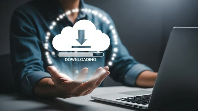 Person holding cloud downloading icon above hand while using laptop on a dark background scene