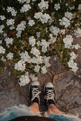 Feet and Flowers Photo in Outdoor Setting