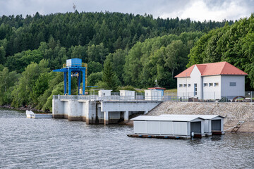 Hydropower station and boat garages by forest