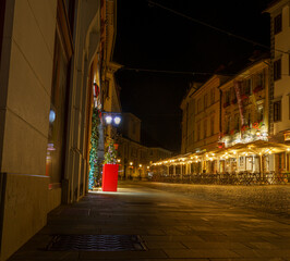 Quiet streets of Ljubljana Old Town at night with lamps and flowers