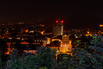 Ljubljana cityscape at night with skyline, streets and historic buildings