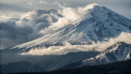 Snowy mountain peaks rise above the clouds in a scenic landscape on a bright sunny day view from below - ai generated