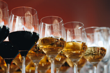 Elegant Wine Glasses with Red Background