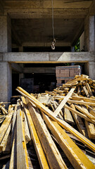 Construction Site with Lumber and Concrete Structure