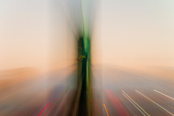 Twilight scene with buildings in the background and motion blur. Zoom in zoom out.