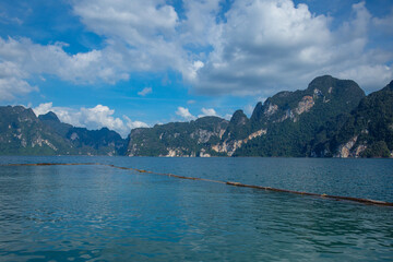 Aerial view of khao sok national park's serene lake and majestic mountains in thailand