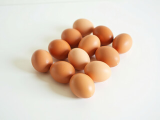 Fresh Brown Eggs on White Background