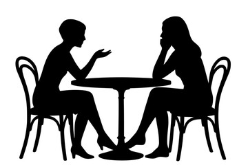Silhouettes of Two Women Engaged in Conversation at a Table